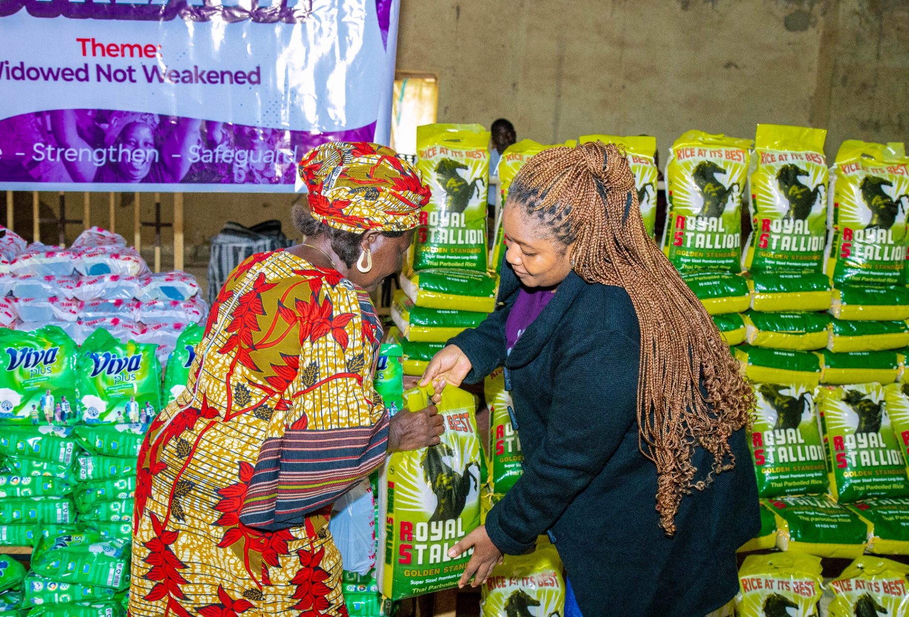 Handover of rice and provisions to a widow